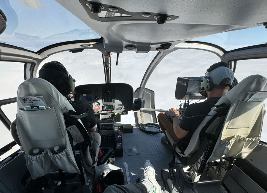 Maverick Helicopters Airbus EC130 in flight, captured mid-air during an aerial cinematography production inside cabin.