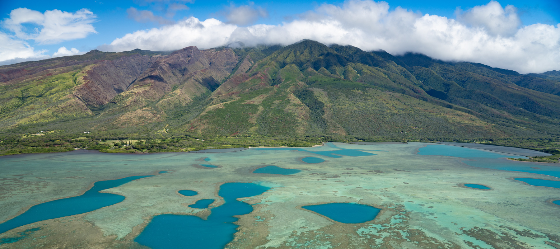 Enjoy the views of the Molokai shoreline and turquoise coastal waters