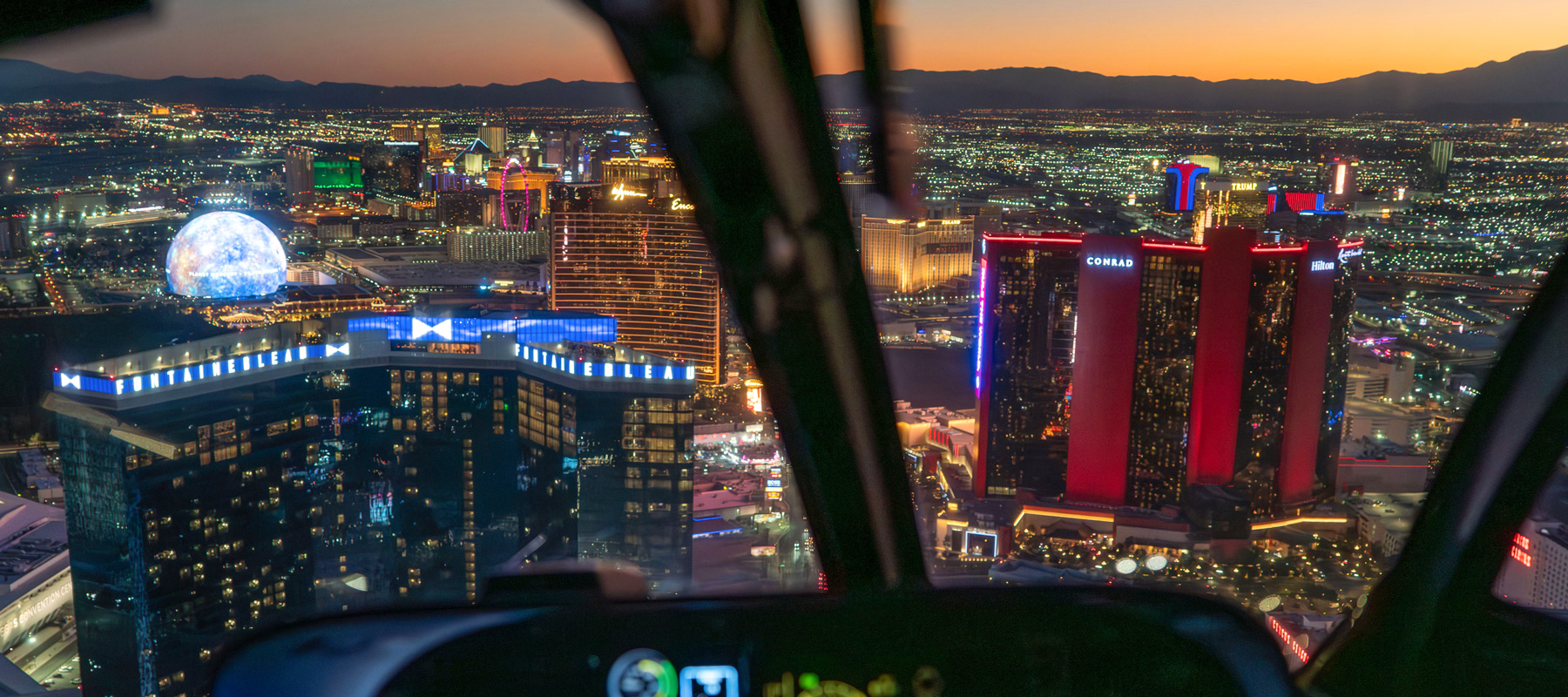 Las Vegas Strip and its illuminated resorts viewed from a helicopter